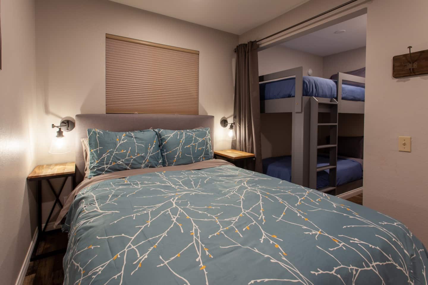 Primary bedroom with king bed and forest views